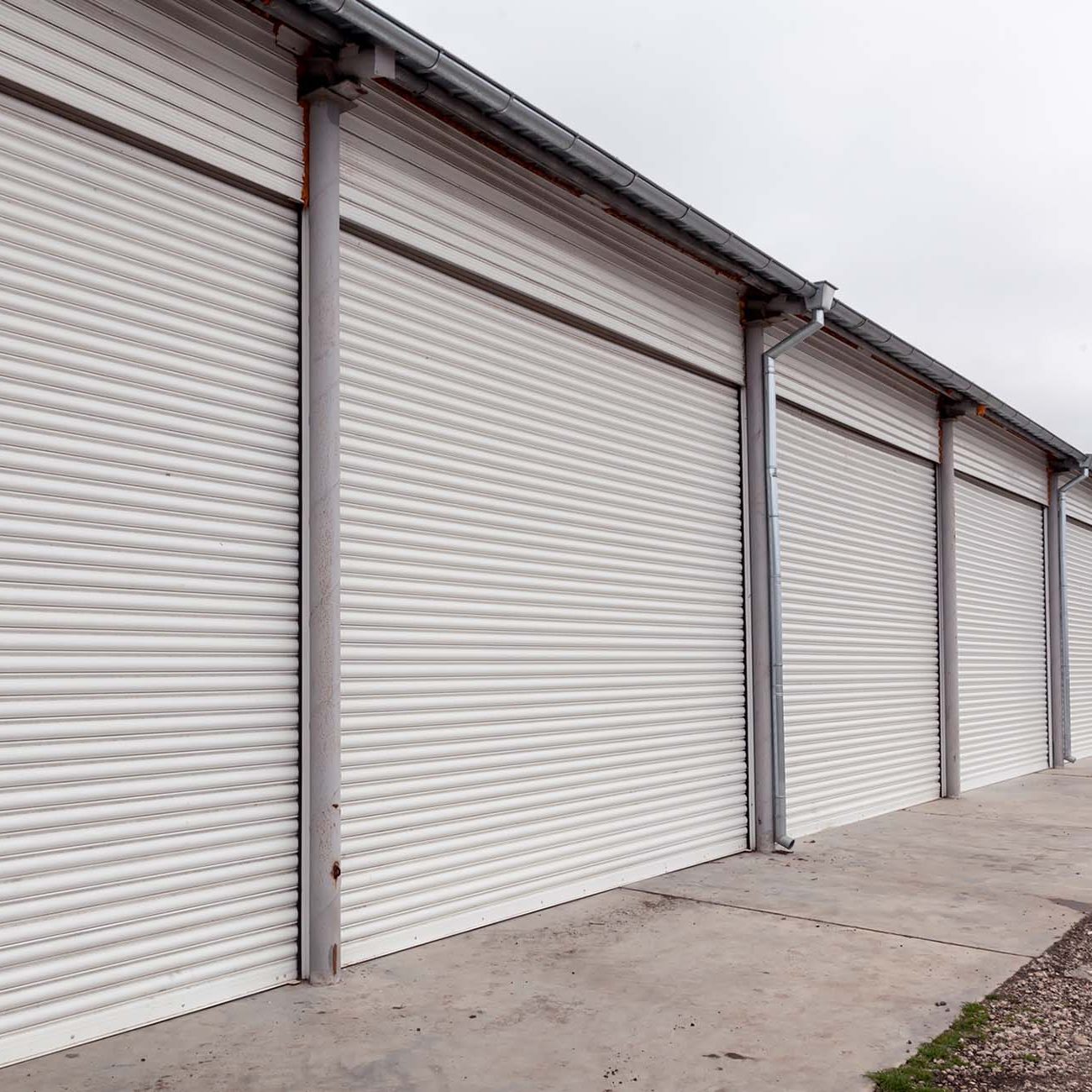 Windows protected with roller shutters, background texture.